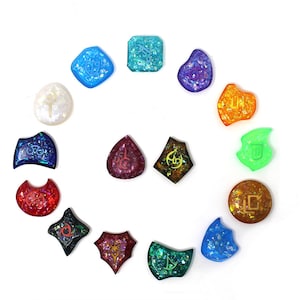 May include: A set of 14 colorful, iridescent, resin dice with various symbols and designs. The dice are arranged in a circle on a white background.