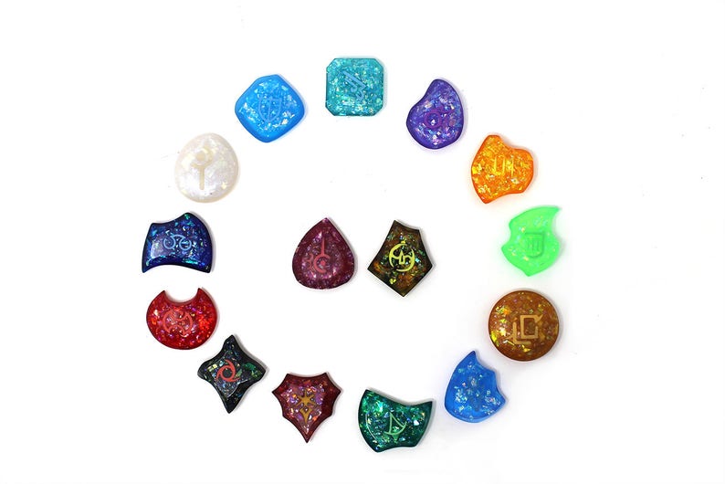 May include: A set of 14 colorful, iridescent, resin dice with various symbols and designs. The dice are arranged in a circle on a white background.