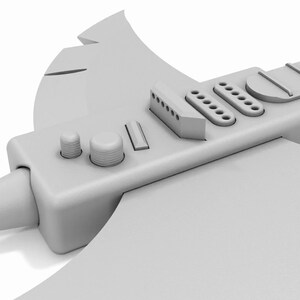Puede incluir: Una guitarra el&eacute;ctrica gris en forma de hacha con una punta puntiaguda y una hoja grande y plana. La guitarra tiene un dise&ntilde;o tradicional con un diapas&oacute;n, perillas y un selector de pastillas.