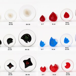 May include: Set of six pairs of ear gauges in various colors and designs, including black, white, red, blue, and green. Each pair comes in three sizes: 3-7 mm, 8-14 mm, and 15-25 mm. The largest size is 26-35 mm.