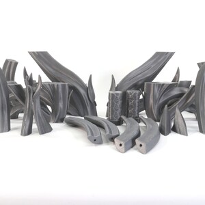 May include: A set of 16 gray 3D printed pieces, some are curved and some are straight, resembling branches or stems.
