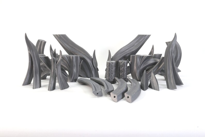 May include: A set of 16 gray 3D printed pieces, some are curved and some are straight, resembling branches or stems.