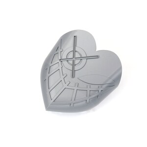 May include: A gray, heart-shaped object with a leaf-like design and a crosshair pattern. The object has a grid-like pattern and a curved edge, suggesting it may be a decorative item or a component of a larger design. The object is on a white background.