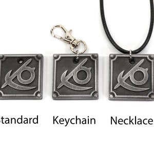 May include: Three silver metal pendants with a stylized eye design. The pendants are shown in three different styles: standard, keychain, and necklace.