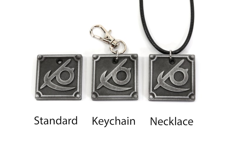 May include: Three silver metal pendants with a stylized eye design. The pendants are shown in three different styles: standard, keychain, and necklace.