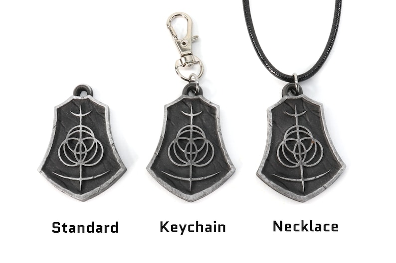 May include: Three silver pendants with a black and silver design. The pendants are shown in three different styles: standard, keychain, and necklace.