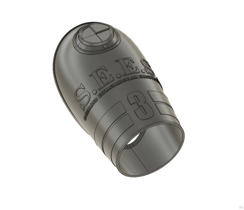 May include: A gray, cylindrical object with the text "S.E.S. SPECIALIZED EXTRACURRICULAR 3D" embossed on its surface. The object has a circular opening at one end and a circular top with a cross-shaped design.