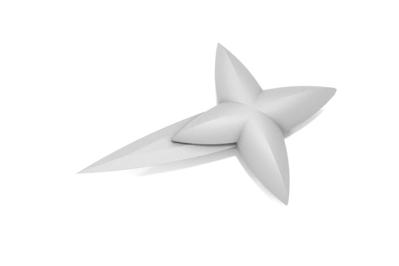 May include: A white, four-pointed star-shaped object made of paper. The star is folded in half, with one half of the star overlapping the other half.