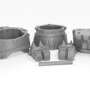 May include: A set of five gray plastic pieces for building a model. The pieces include a base, two legs, and two arms.