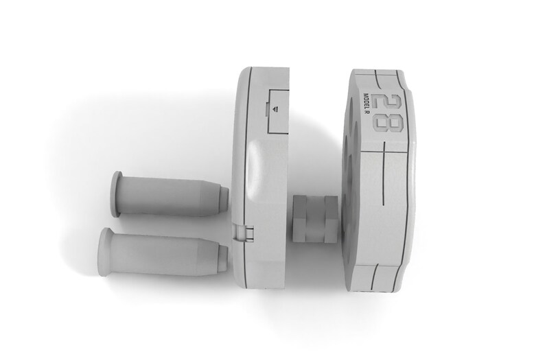 May include: A disassembled gray metal weight with the text "MODEL R 28" printed on the side. Two gray metal sleeves are also included.