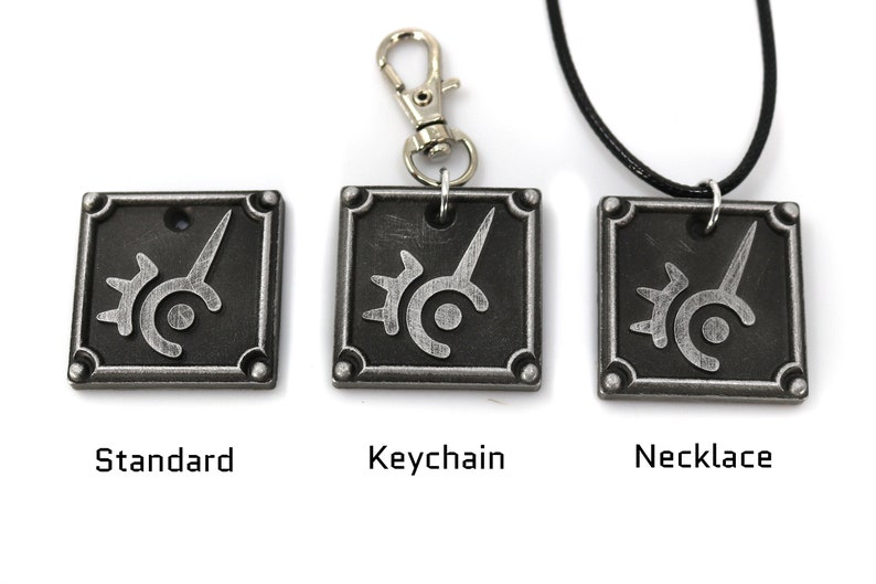 May include: Three versions of a silver metal pendant featuring the Final Fantasy VII logo. The pendant is available as a standard charm, a keychain, and a necklace.