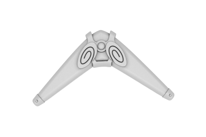 Puede incluir: Un boomerang de pl&aacute;stico blanco con un dise&ntilde;o circular en el centro. El boomerang es un juguete para jugar al aire libre.