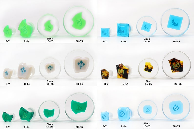 May include: Set of four different ear gauges with various designs and colors. The gauges are made of clear acrylic with a variety of colors and designs. The designs include a leaf, a shield, a flower, and a geometric shape. The gauges are available in four sizes: 3-7, 8-14, 15-25, and 26-35.