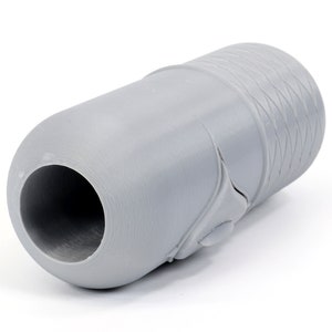 May include: A gray plastic pipe fitting with a textured surface.