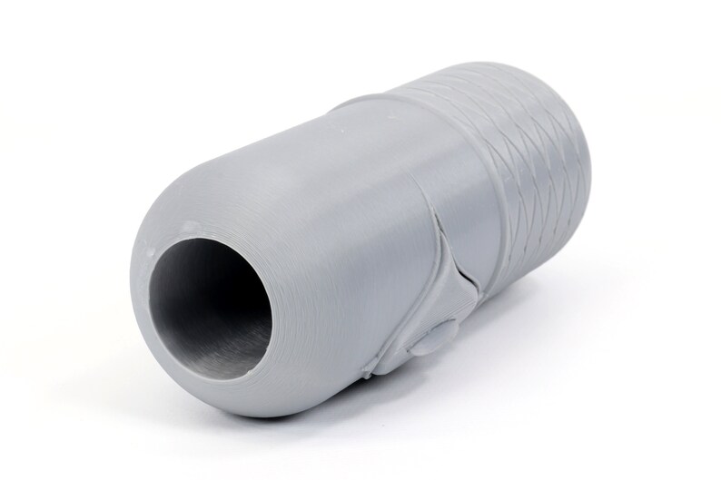 May include: A gray plastic pipe fitting with a textured surface.