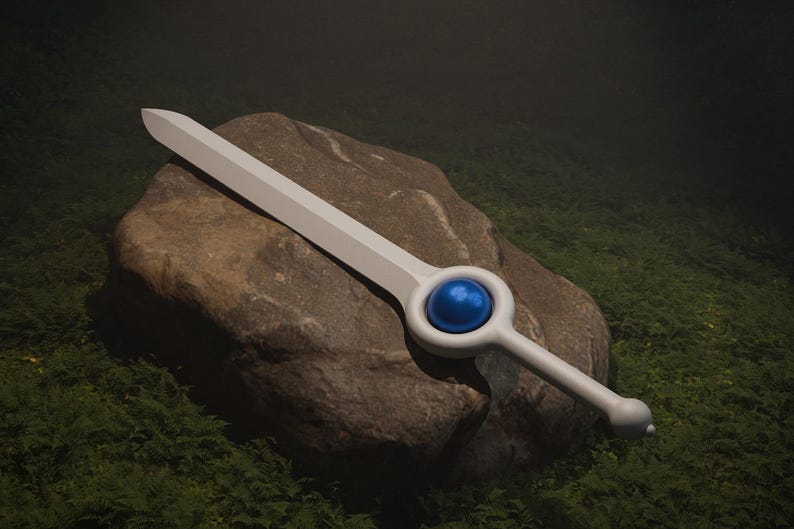 May include: A white sword with a blue gem in the handle, resting on a rock covered in green moss.