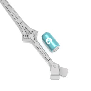 May include: A light gray sword-shaped object with a teal can. The sword has a detailed design with text along the blade. The can is teal with a white circular logo. The objects are on a white background.