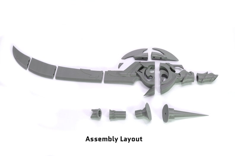 May include: Assembly layout for a 3D printed sword with multiple pieces. The sword is gray and has intricate details. The pieces are laid out on a white surface.