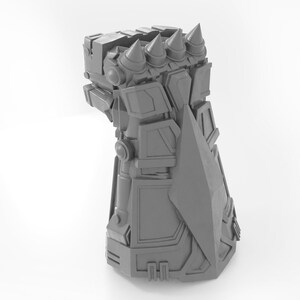 May include: A gray 3D printed model of a robotic hand with a sharp blade on the side and spikes on the top.