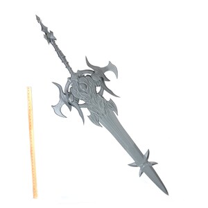 May include: A large, silver-colored sword with intricate details and a sharp point. The sword has a long, straight blade and a complex hilt with multiple points.