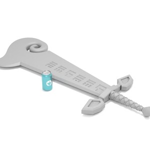May include: A gray plastic toy sword with a blue can next to it. The sword has a curved handle and a blade with a pattern of squares.