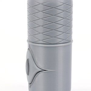 May include: A gray lightsaber hilt with a textured diamond pattern on the top section and a smooth gray section below. The hilt has a small, round button on the side.