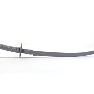 May include: A gray metal sword with a curved blade and a detailed handle.