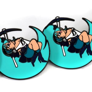 May include: Four turquoise blue enamel pins with a black outline. Each pin features a cartoon character with blue hair, a white shirt, and black pants, sitting on a crescent moon with a pickaxe.