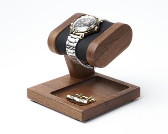 Wood watch stand with black soft leather pillow and place for storage keys, ring, cuff links, jewelry