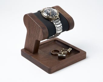 Wood watch stand with black soft leather pillow and place for storage keys, ring, cuff links, jewelry