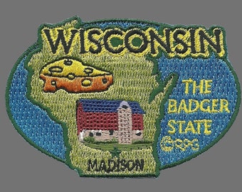 May include: Embroidered patch featuring the state of Wisconsin. The patch includes the state outline, a cheese wedge, a barn, and the text "WISCONSIN", "THE BADGER STATE", and "MADISON". The patch is bordered in blue and green.