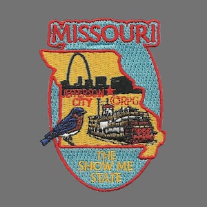 May include: A red, white, and blue embroidered patch with the outline of the state of Missouri. The patch features the Gateway Arch, a steamboat, a bluebird, and the text "Missouri", "Jefferson City", "The Show Me State", and "Corps".