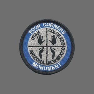 May include: Embroidered patch featuring the Four Corners Monument. The design includes a blue border, the words "Four Corners Monument," and the names of the four states: Utah, Colorado, Arizona, and New Mexico. The patch also features handprints and footprints.