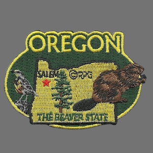 May include: Embroidered patch depicting the state of Oregon, featuring a beaver, a bird, and a tree. The text "Oregon" and "The Beaver State" are also included.