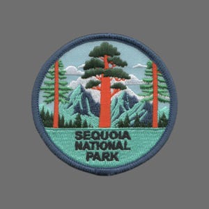 May include: A blue and green embroidered patch with a depiction of a giant sequoia tree in Sequoia National Park. The text "Sequoia National Park" is embroidered in black below the tree.