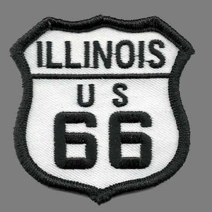 May include: White and black embroidered patch with the text "ILLINOIS US 66" on a shield shape.