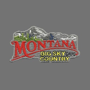 May include: Embroidered patch with a gray background featuring a stylized mountain range and the text "Montana Big Sky Country". The text "Montana" is in red, and the text "Big Sky Country" is in yellow.