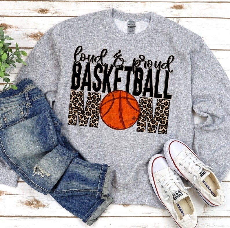 May include: Grey sweatshirt with the text "Loud & Proud Basketball Mom" in black lettering with a basketball and leopard print design.