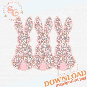 May include: Three pink floral patterned bunny silhouettes with pink ears and feet. The bunnies are arranged in a row, facing forward.