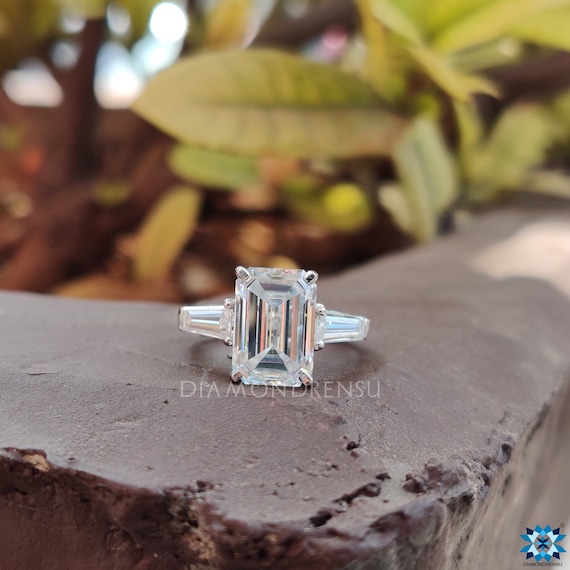 TCW Emerald and Tapered Baguette Moissanite Three Stone