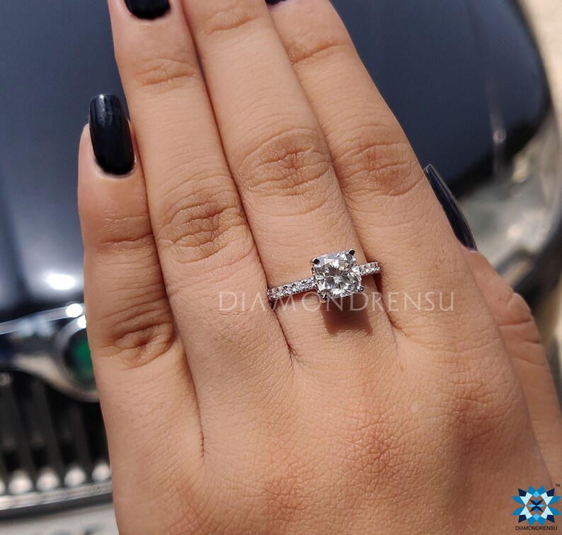 elongated cushion hidden halo engagement ring