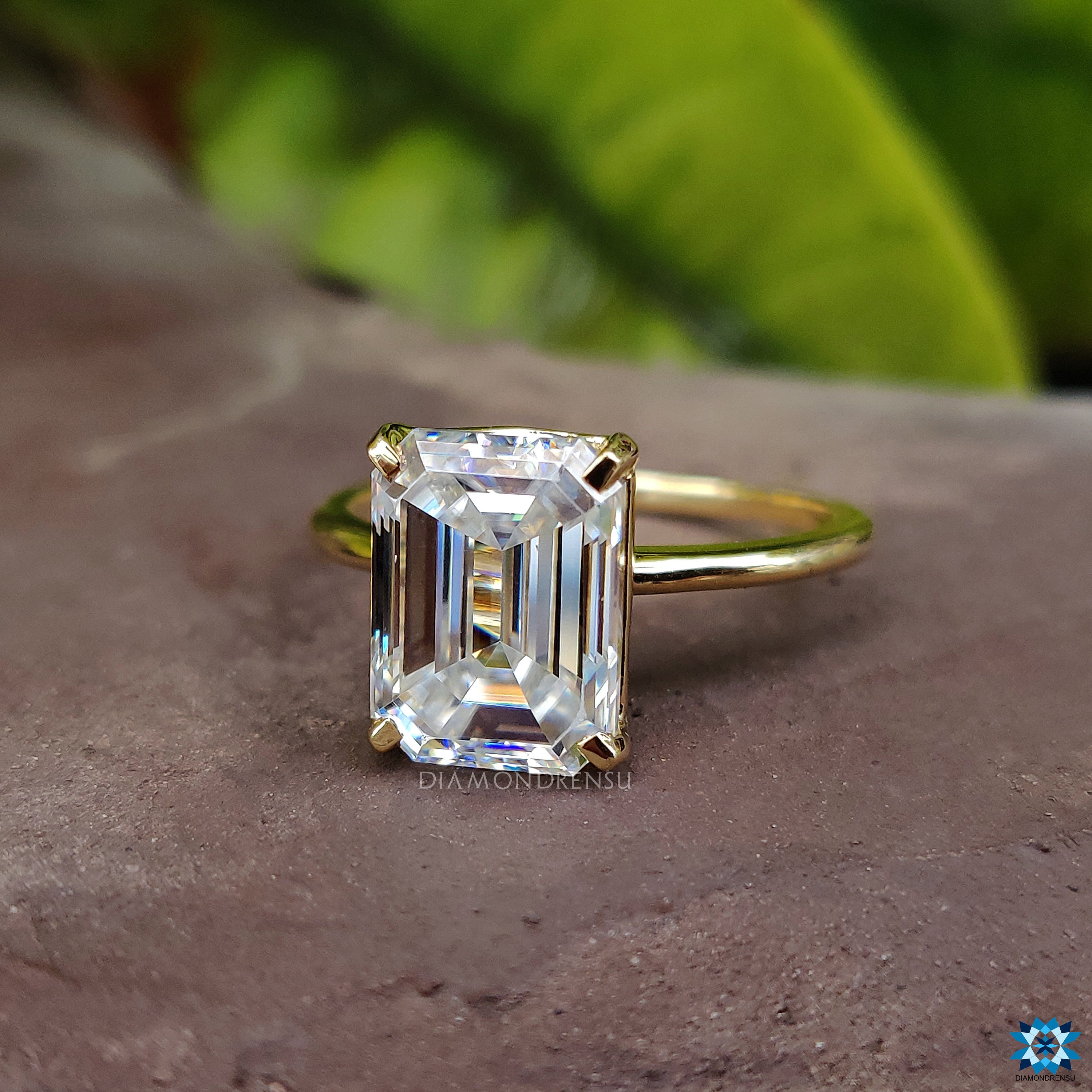 Gold band emerald cut diamond best sale ring