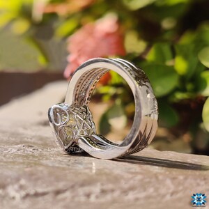 Light yellow cushion cut engagement ring paired with a slim band.