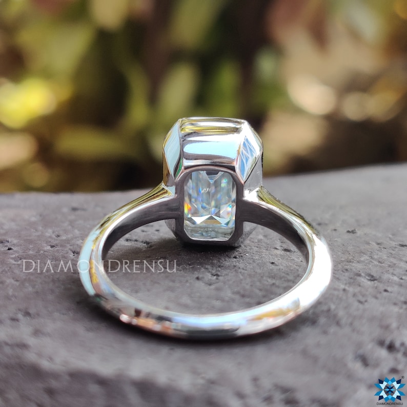 Moissanite solitaire ring shines with timeless brilliance.
