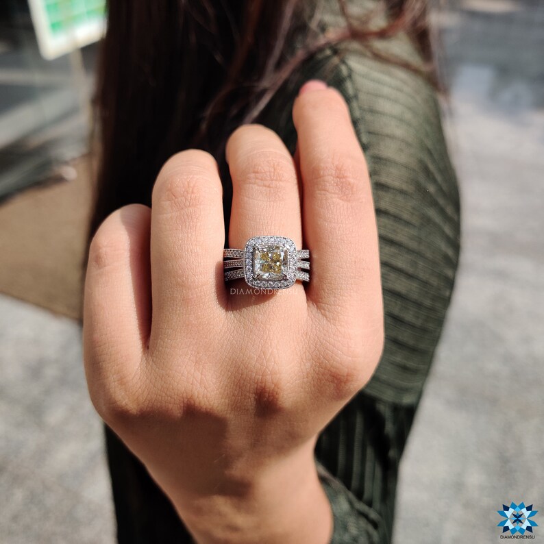 Halo engagement ring styled with a circular diamond frame.