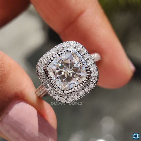 High profile cathedral vintage style halo engagement ring