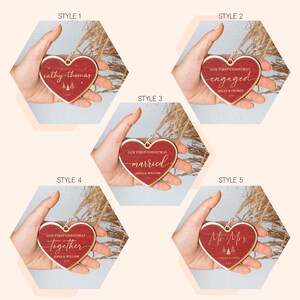 May include: Five different styles of red wooden heart ornaments with personalized text. The ornaments feature the words "engaged", "married", "together", "Mr & Mrs", and "cathy-thomas".