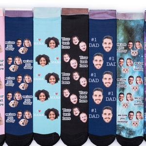 May include: Set of eight colorful socks with different designs. Each sock features a repeated pattern of a person's face, a pet, and text. The text includes "Your text here", "#1 Dad", "We love you mommy", "We love you daddy", "Pete's Mom", and "I love Mama".