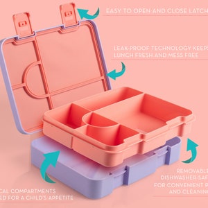 May include: A pink and purple lunchbox with five compartments and a removable tray. The lunchbox has easy-to-open latches and leak-proof technology to keep food fresh. "5 Practical Compartments Portion for a Child's Appetite" and "Removable, Dishwasher-Safe Tray for Convenient Packing and Cleaning" are written on the lunchbox.