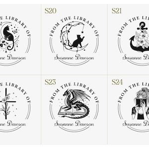 May include: A collection of six black and white circular stamps. Each stamp features the text "FROM THE LIBRARY OF" and the name "Susanne Dawson". The stamps depict various designs, including a cat, anchor, cross, dragon, and a person.